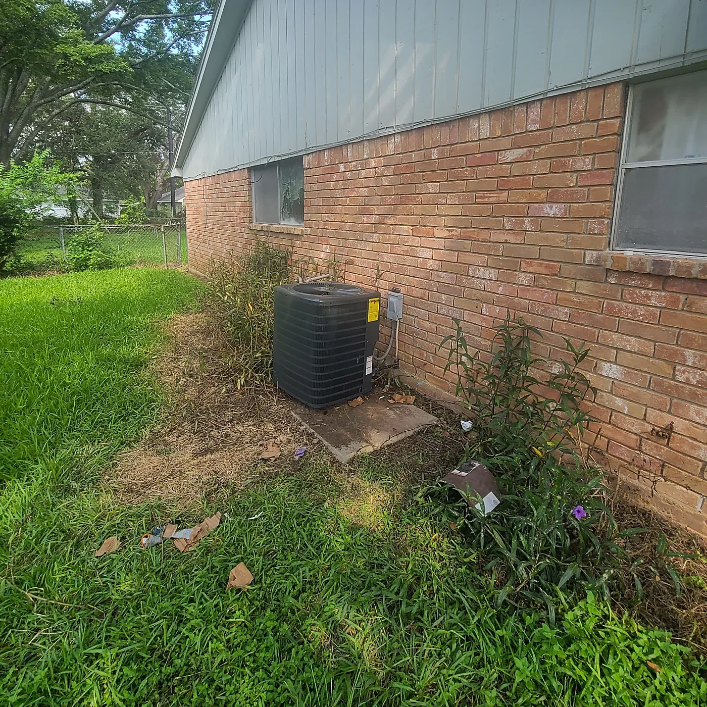 HVAC technician repairing air conditioner Spring TX AC repair service North Houston