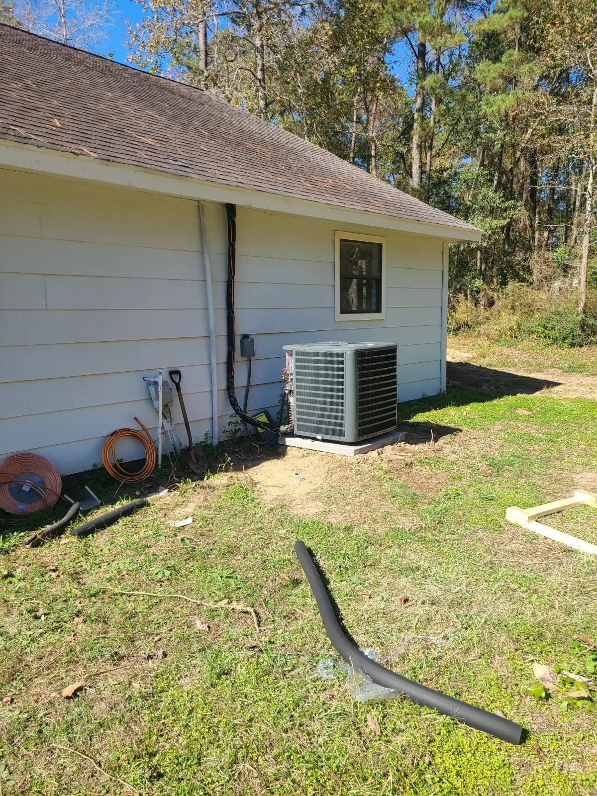 ac residential condenser install side yard 01 Spring Texas