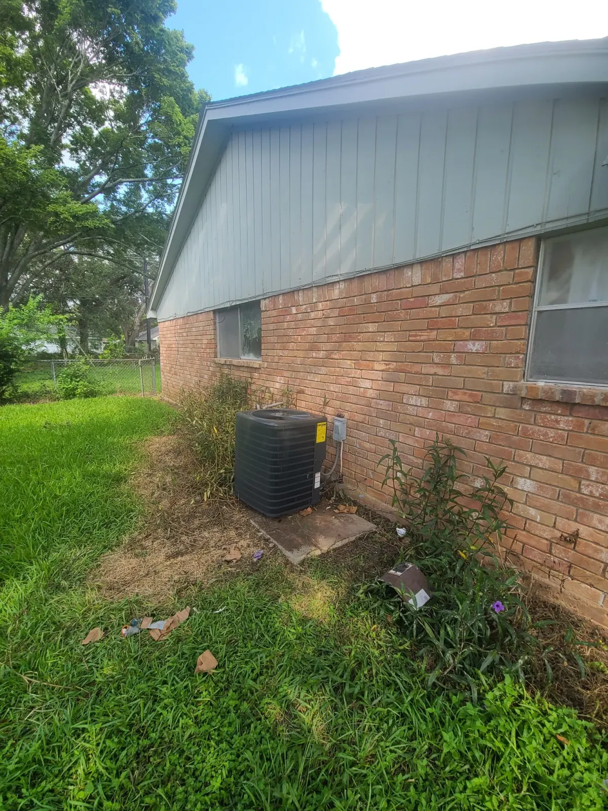 HVAC technician repairing air conditioner Spring TX AC repair service